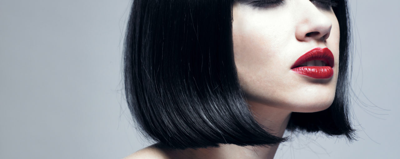 This is a retro haircut from the 1960s era.  Slick sleeky glosss black hair color.