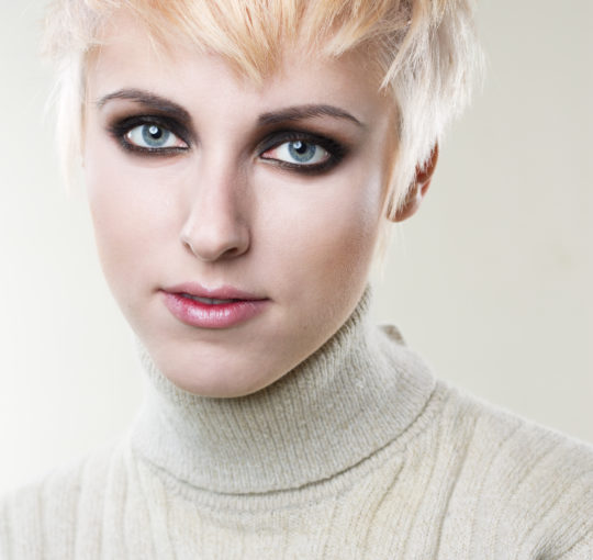 Sassy short pixie hair golden blond and platium womans hairstyle.