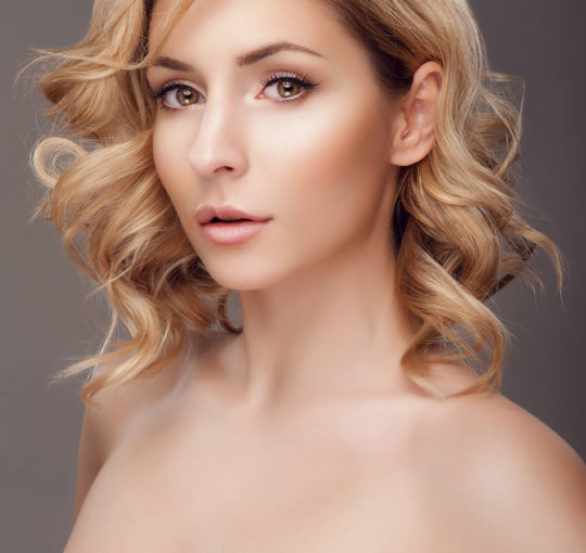 Balayage with Naural blond tones.  Great large waves done with large wand.