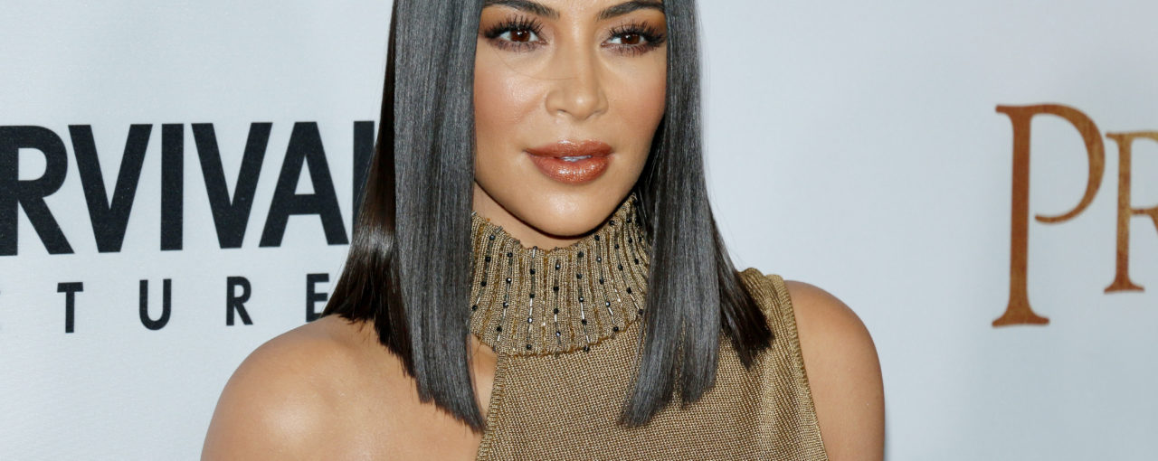 Kim Kardashian - Sleek straight black lob hairstyle.