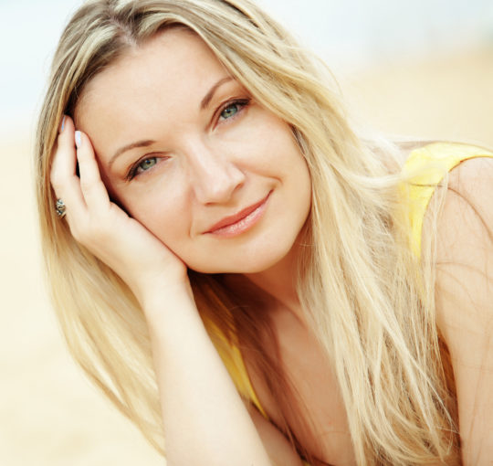 Natural looking lightest blond highlights on dark blond hair.