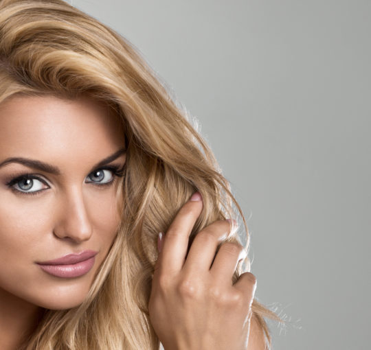 light golden brown base, lots chunky butter colored highlights on thick hair