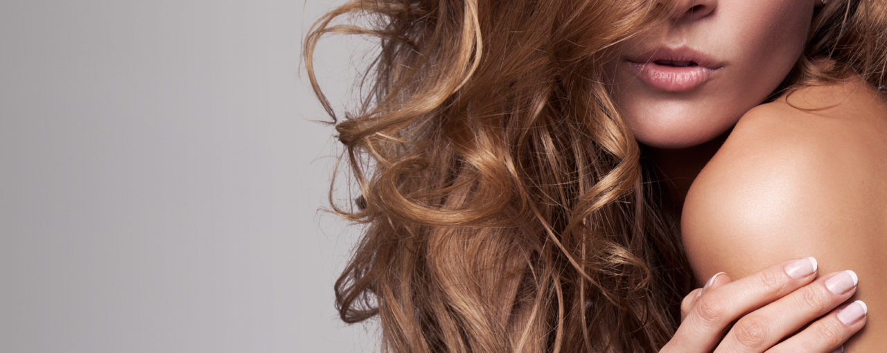 The long layered cut is fashionable with the medium curls done with an iron.