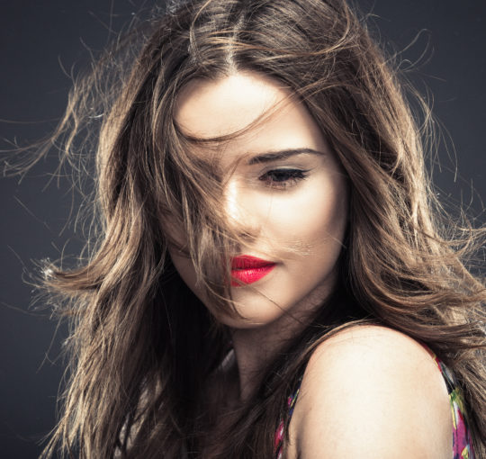 Long messy layers on dark chocolate brown hair.