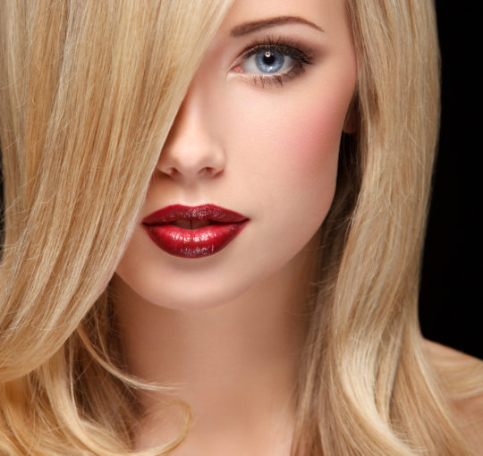 Far side part complimenting a feminine long layered haircut